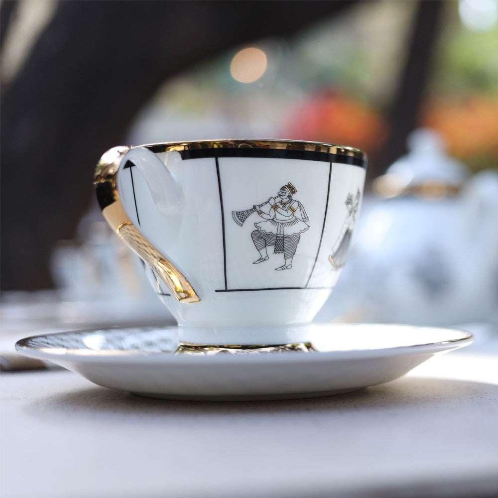 Kaunteya Byah Premium Tea Cup Saucer- Lightweight, fine bone china, tableware, luxury tea cup saucer, set of 2, 24K gold plated, Phad art, beautiful white, black and gold crockery with intricate black and gold wedding design.