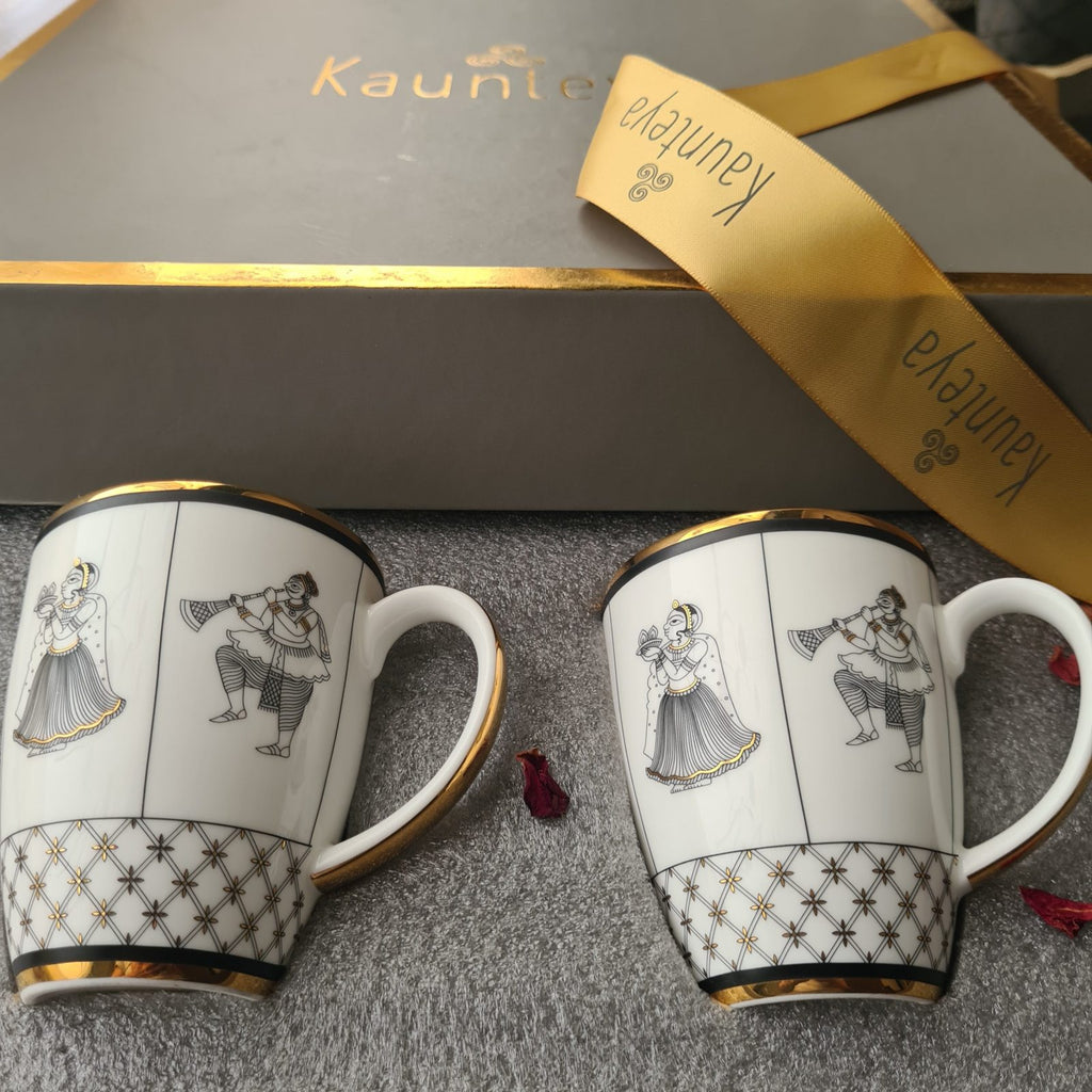 Kaunteya Byah Premium Gift Set- Lightweight, fine bone china, tableware, luxury 2 coffee mugs with a gift box, 24K gold plated, Phad art, beautiful white, black and gold crockery with intricate black and gold wedding design.