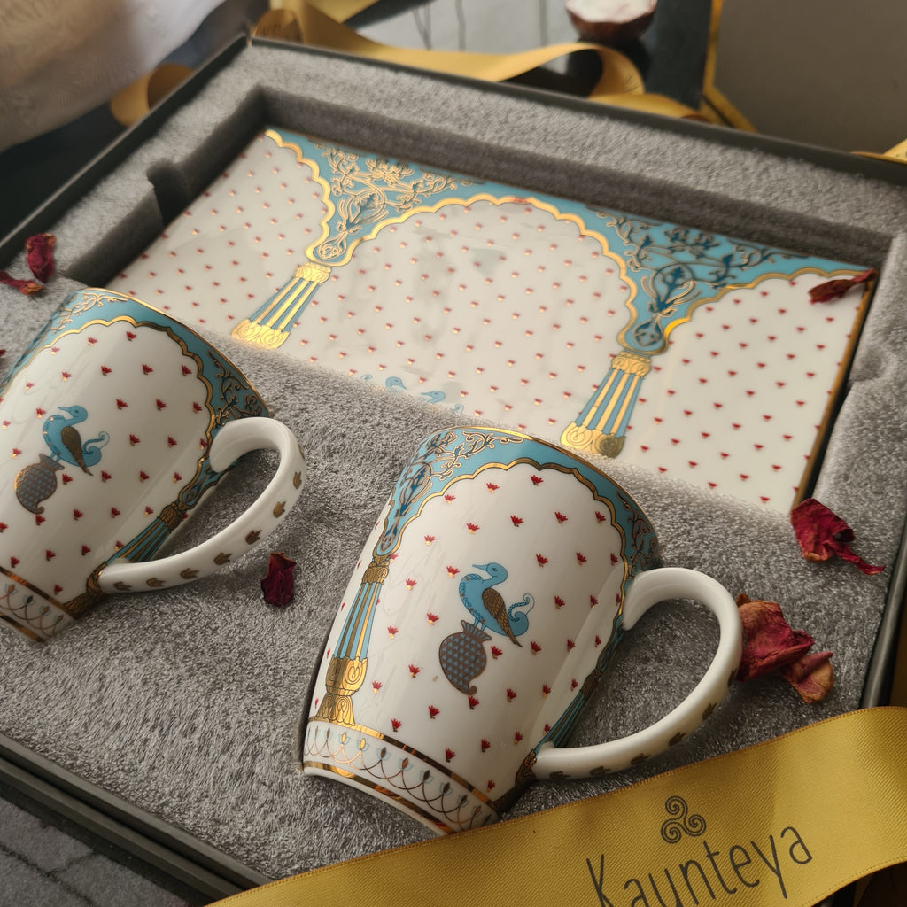 Kaunteya Dasara Premium Gift Set- Lightweight, fine bone china, tableware, cookie plate and 2 coffee mugs with a gift box, 24K gold plated, beautiful blue and white crockery with royal blue and gold birds and pillars design.