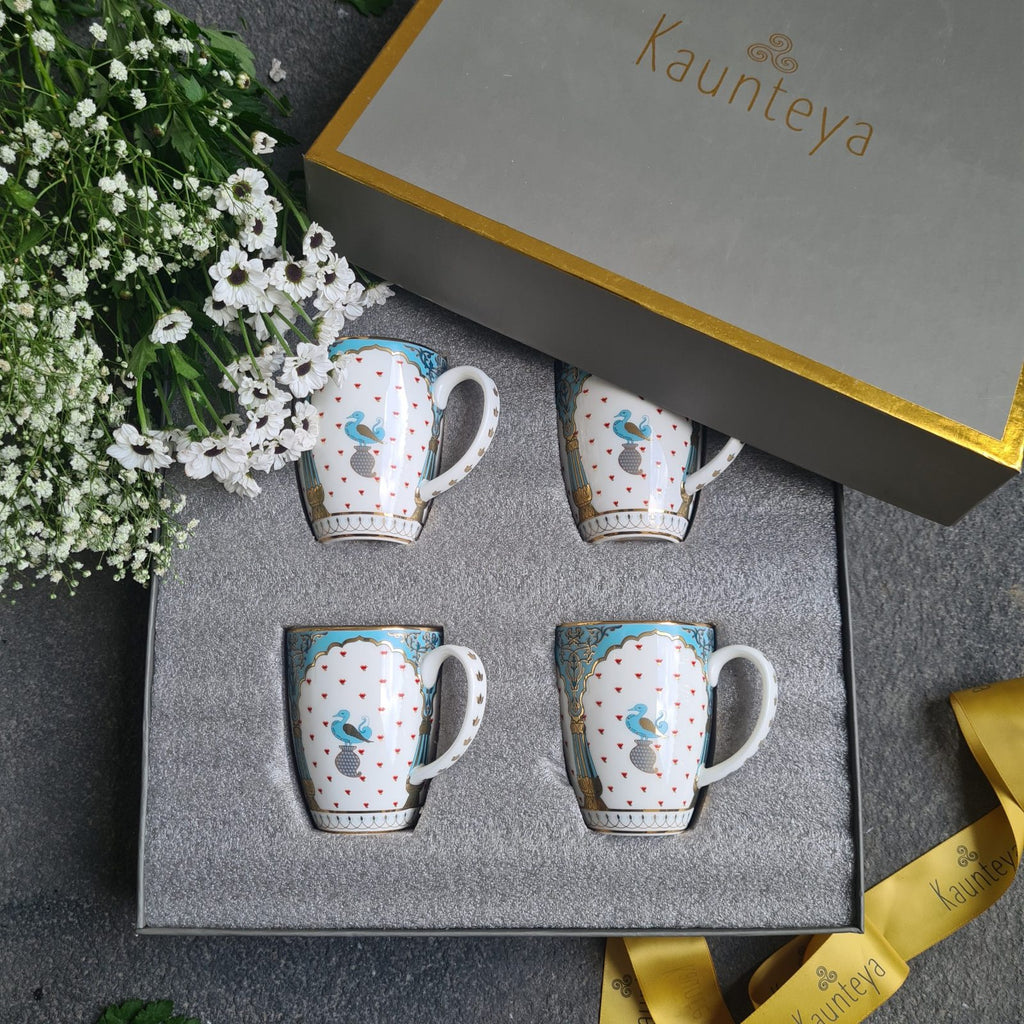 Kaunteya Dasara Premium Gift Set- Lightweight, fine bone china, tableware, 4 coffee mugs with a gift box, 24K gold plated, beautiful blue and white crockery with royal blue and gold birds and pillars design.