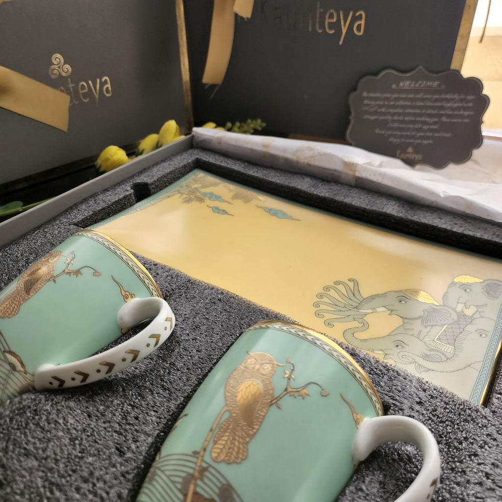 Kaunteya Airavata Premium Gift Set- Lightweight, fine bone china, tableware, luxury cookie plate and 2 green coffee mugs with a gift box, 24K gold plated, Pattachitra art, beautiful green and yellow crockery with intricately designed gold owls and green elephants.