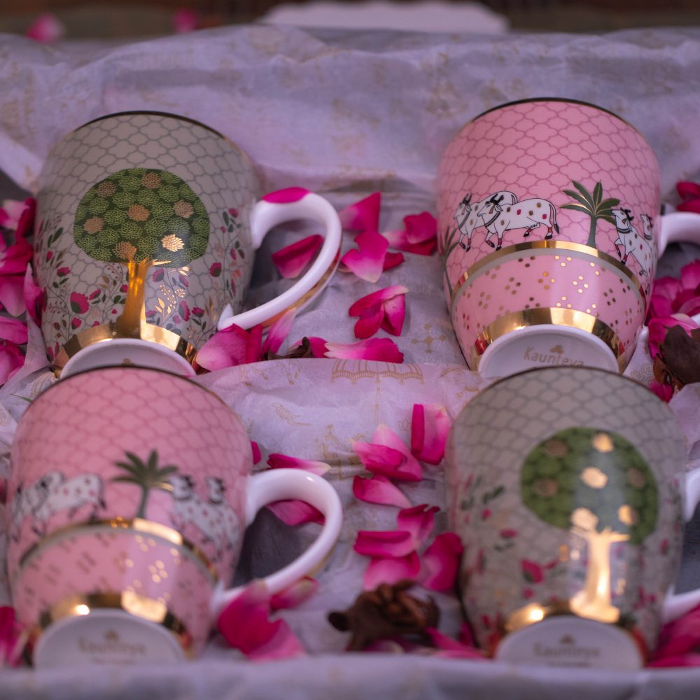 Kaunteya Pichwai Premium Gift Set- Lightweight, fine bone china, tableware, luxury 2 green mugs, 2 pink mugs, gift box, 24K gold plated, beautiful green and pink crockery with intricately designed cows and trees.